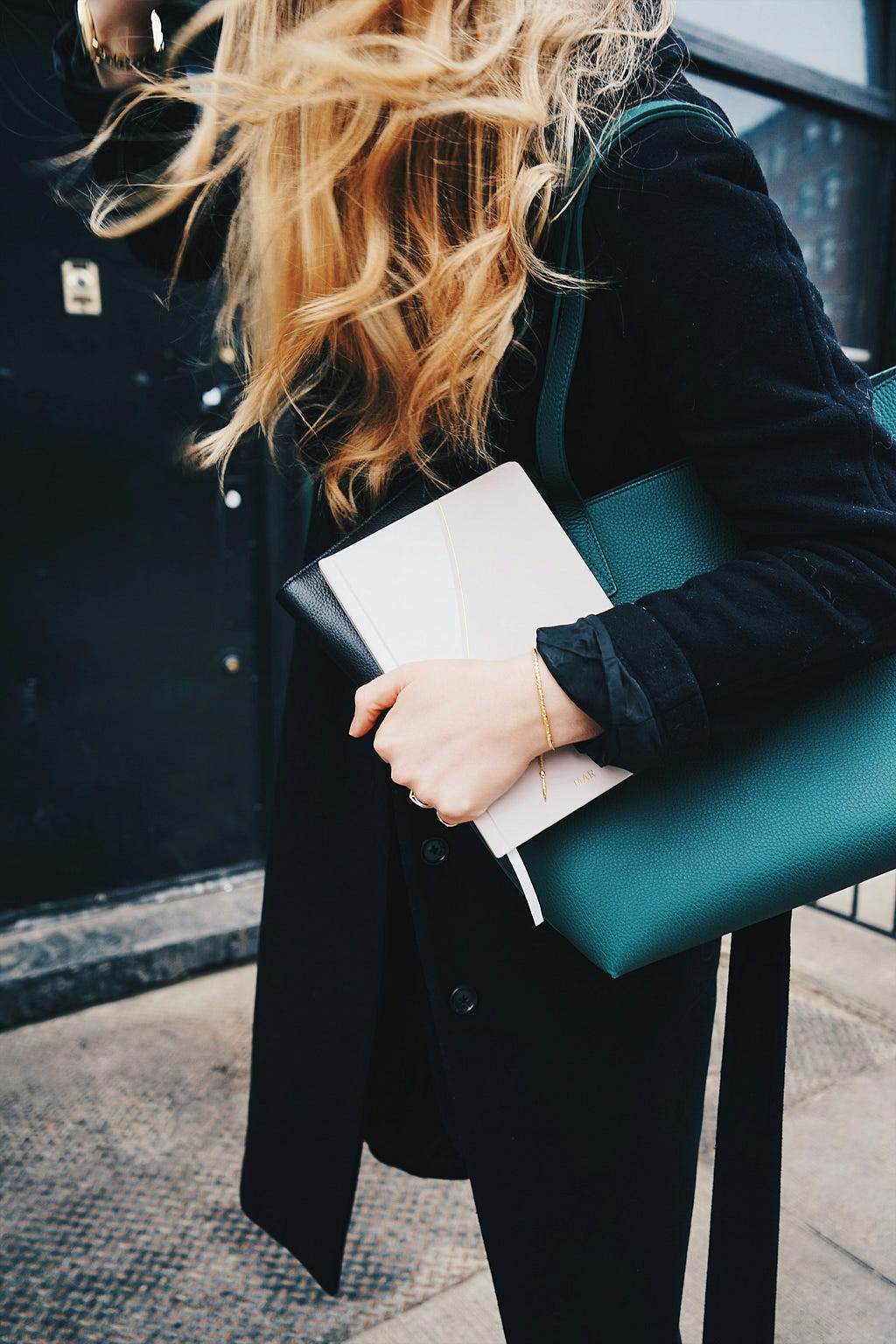 Women holding bag and notebook