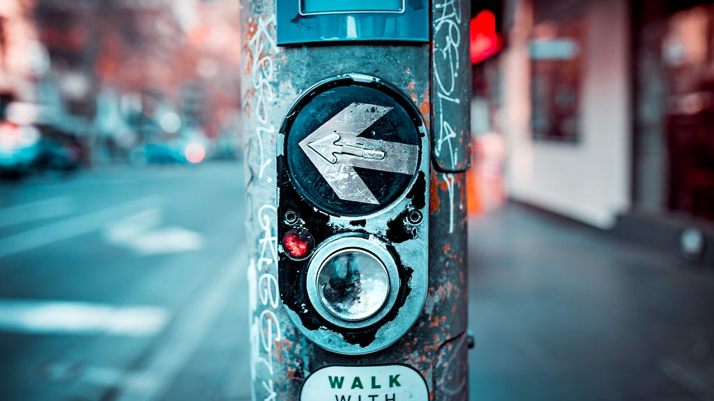 The image of a button that turns on the green traffic light for pedestrians
