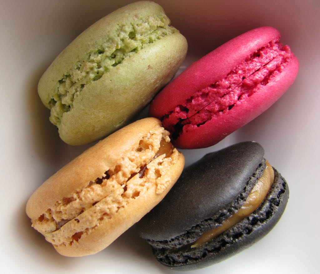 4 differently-colored macarons photographed up-close