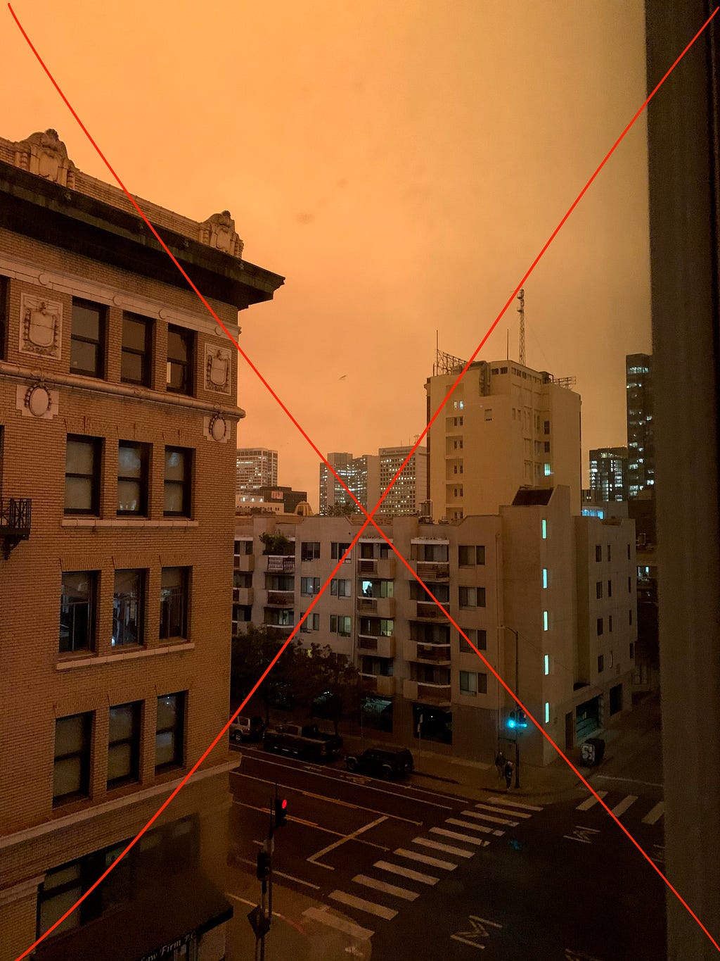 Crossed out image of high rise building against a cloudy orange sky