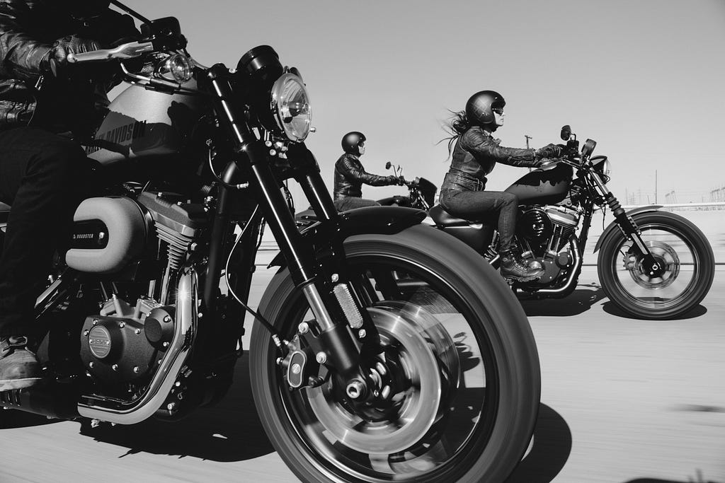 Harley-Davidson Owners Group members in action together.