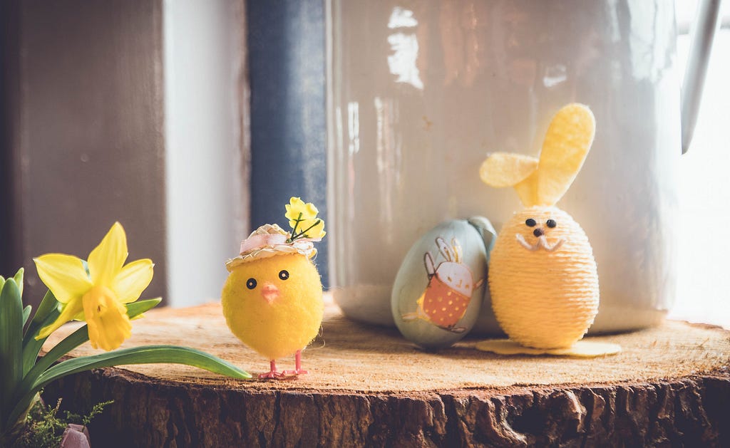 Cute easter toys: toy chicken, plushy rabbit and a painted egg