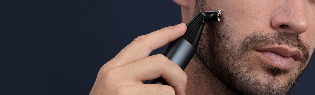 Man shaving with Xiaomi UniBlade Trimmer