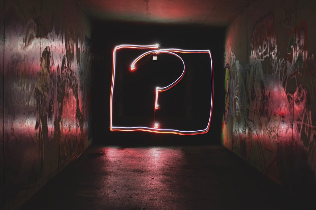 A big neon “question mark” used denote “frequently asked questions”