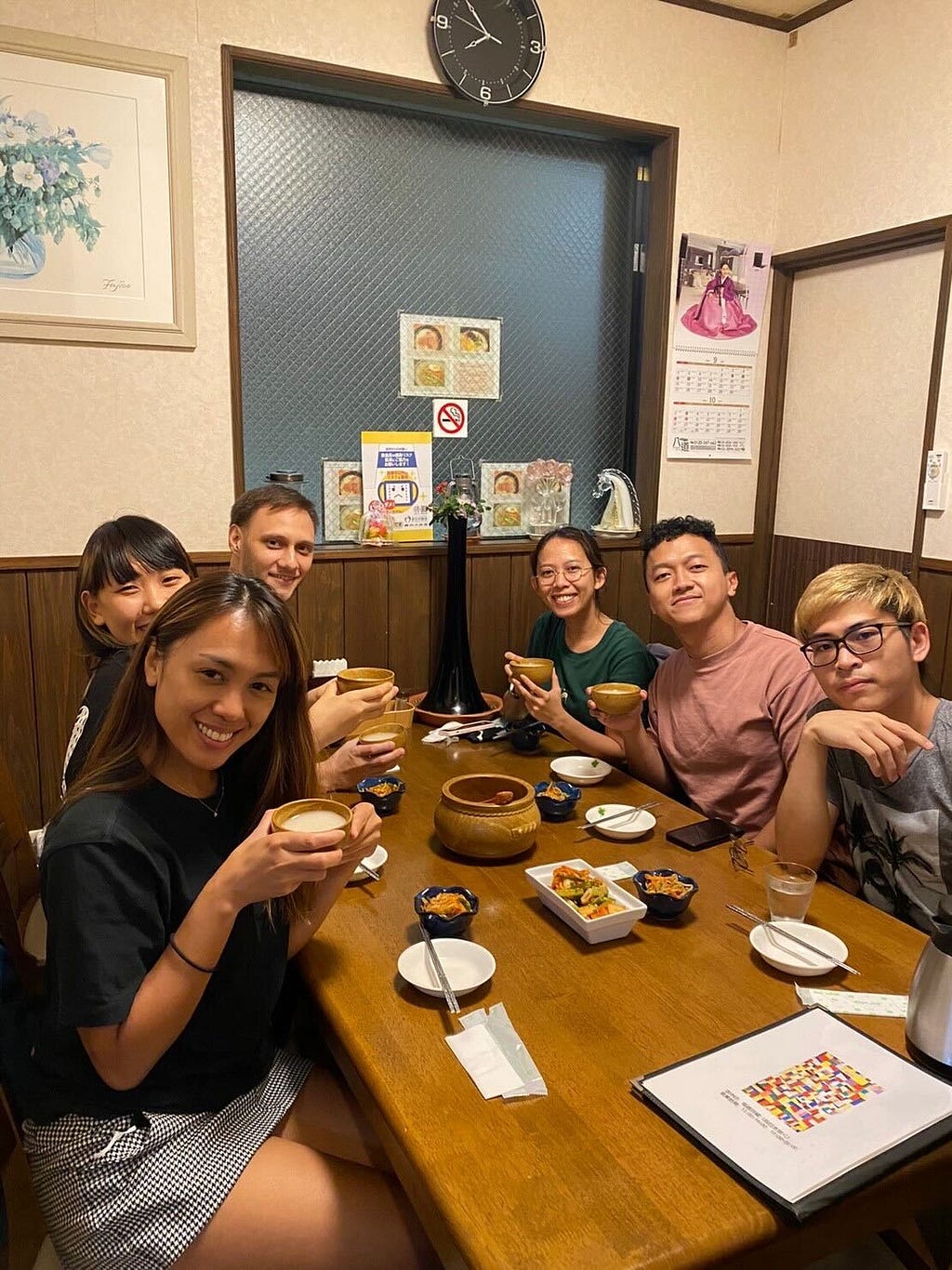 The ETA team minus Naomi posing while holding our Makgeolli drink for Dinner