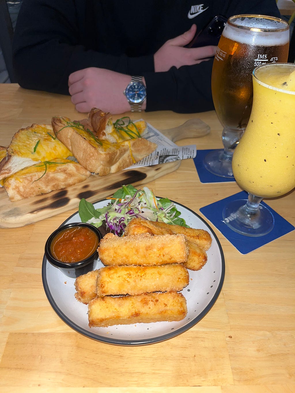 Delicious starters including garlic bread and grilled halloumi sticks at Mika’s Mexican restaurant, offering mouthwatering appetizers with fresh ingredients and bold flavors in Airlie Beach, Queensland, Australia