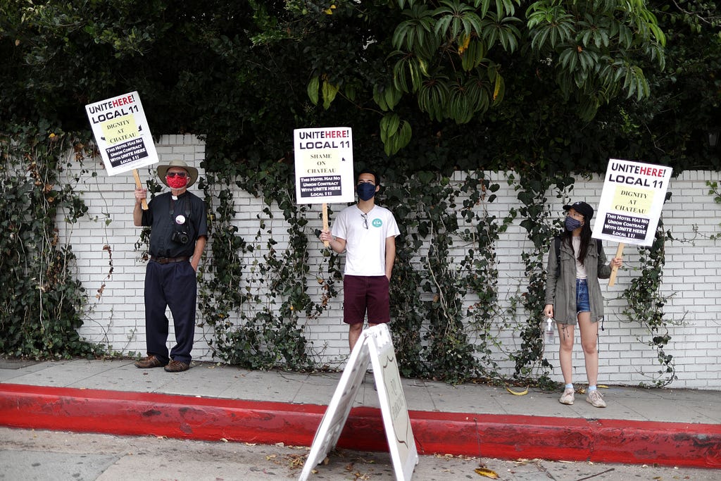 People protest in support of laid-off hotel workers in LA, July 23, 2020. Photo by Lucy Nicholson/Reuters