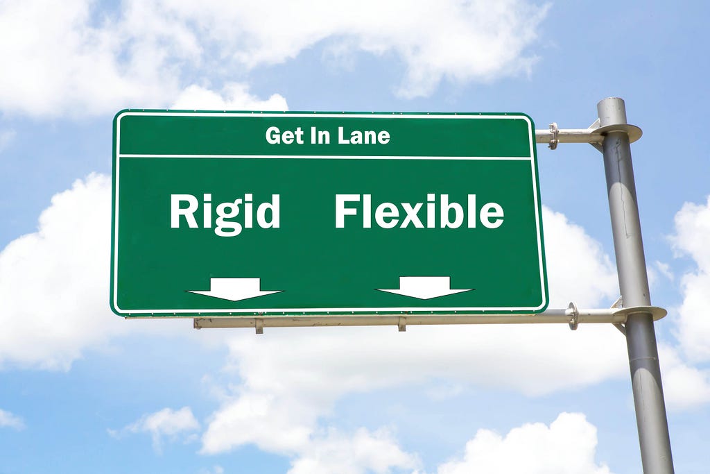 The idea of rigid vs flexible platforms in low-code development reflected via the road sign