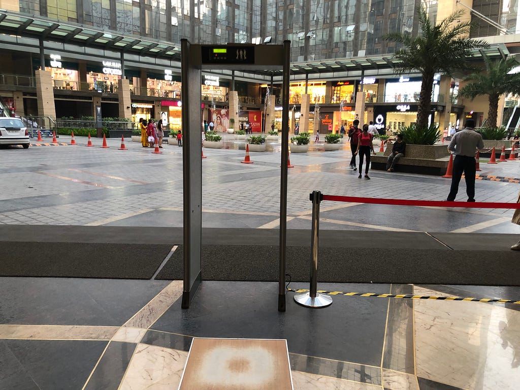 Metal detector gate at the mall entrance.
