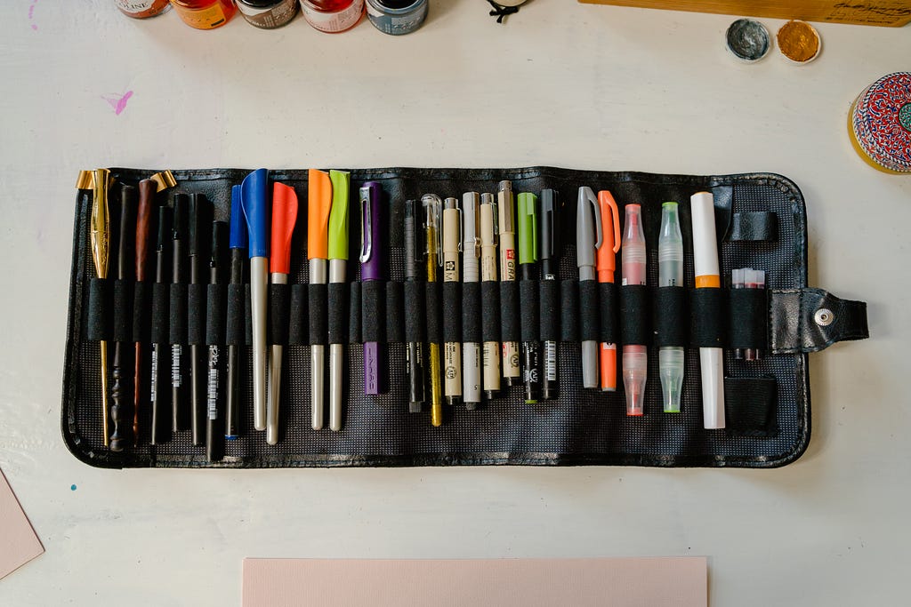 pens placed neatly in a pen case