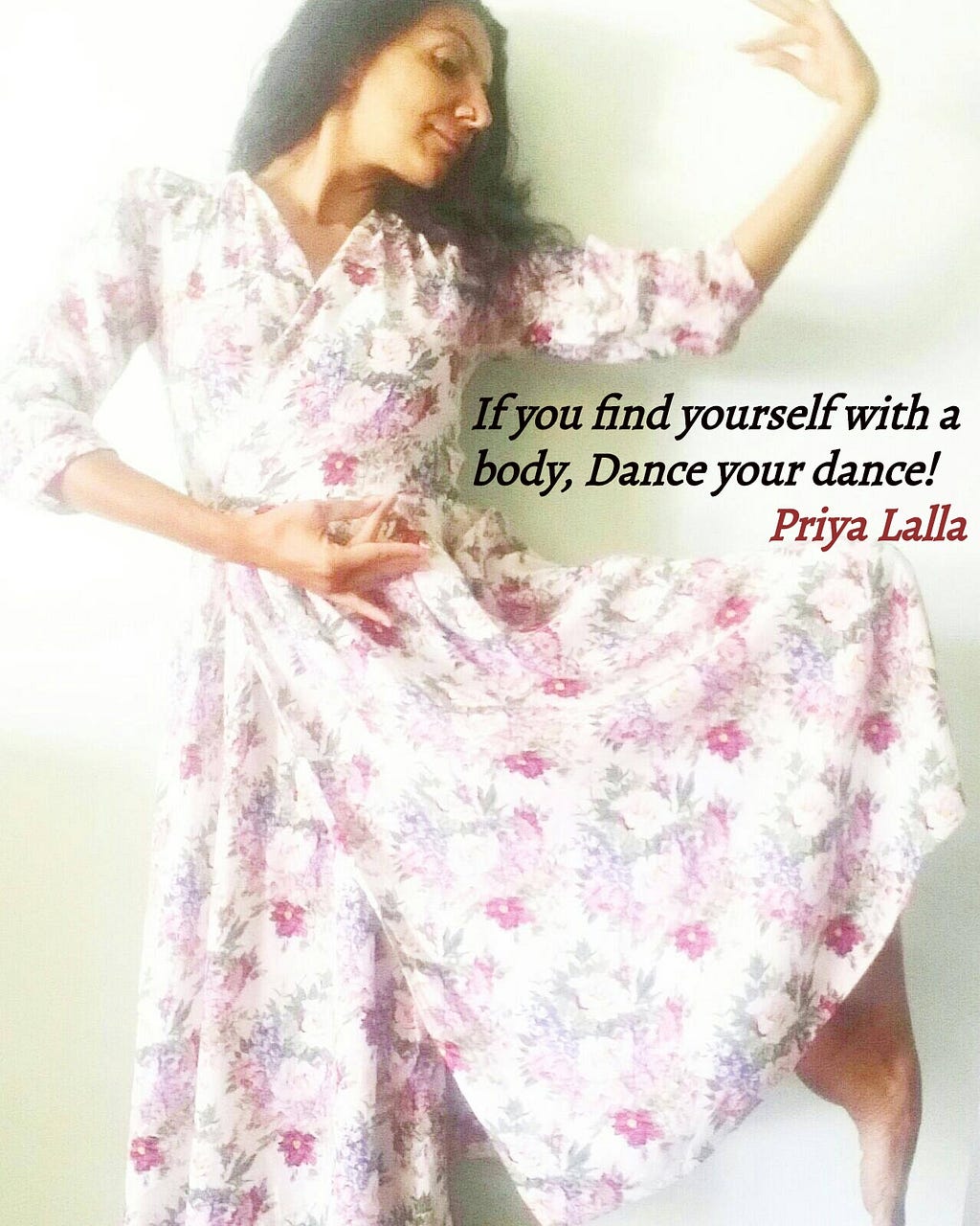 Me wearing a white dress with purple flowers doing a dance pose and my quote saying “If you find yourself with a body, dance your dance!”