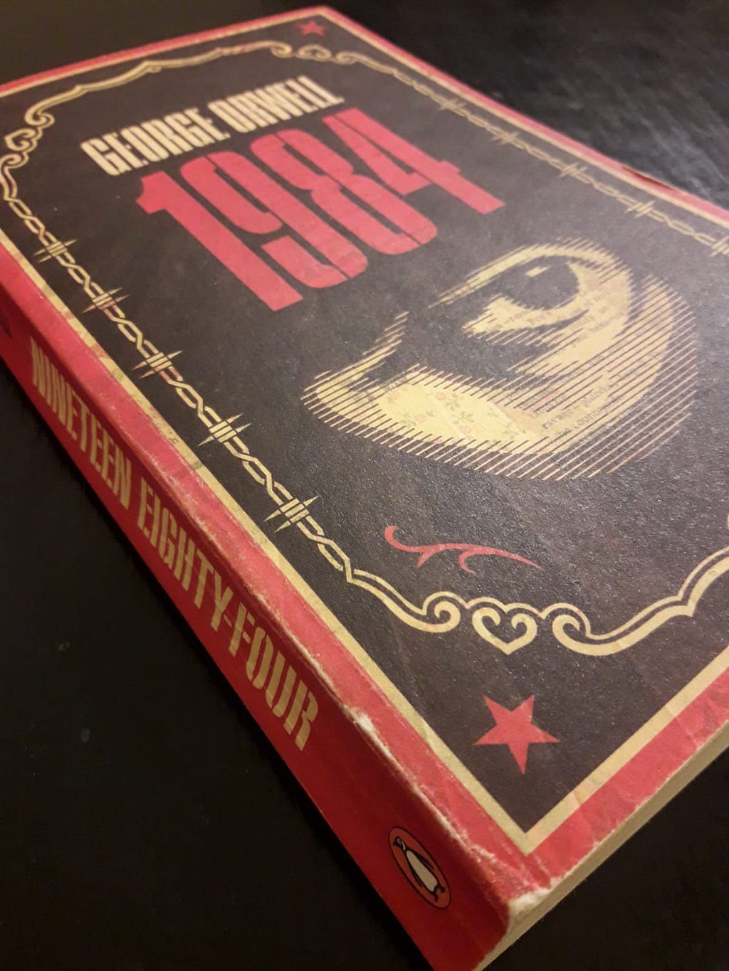 A picture of the book 1984 by George Orwell taken by the author of this article.