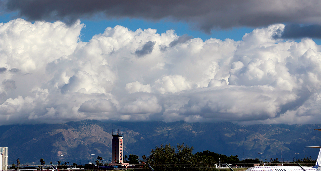 Photo of clouds above an airport.