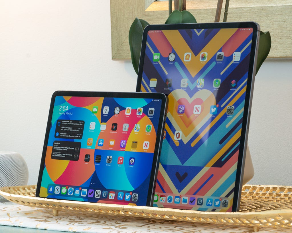 Two iPads standing up side by side