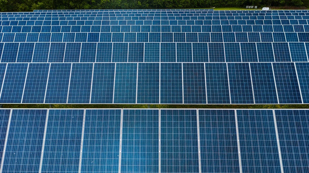 Rows of solar panels facing the viewer