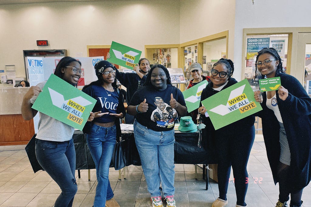 Photo of Shavonne Hines-Foster with volunteers at a voter registration event.