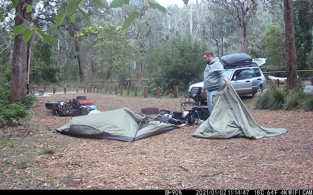 Trail cam photo of me packing up my tent