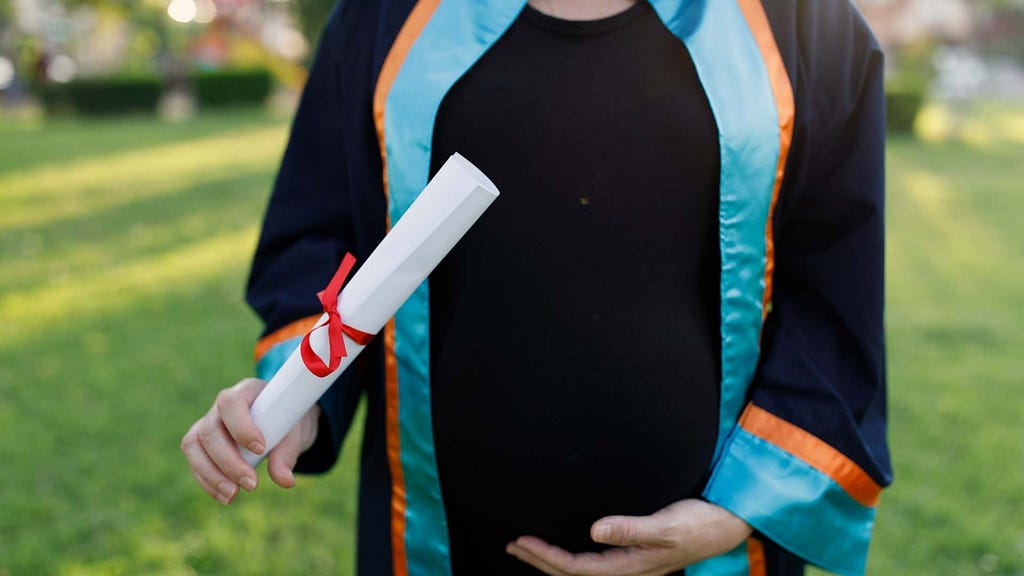 Graduate student holding a university degree.