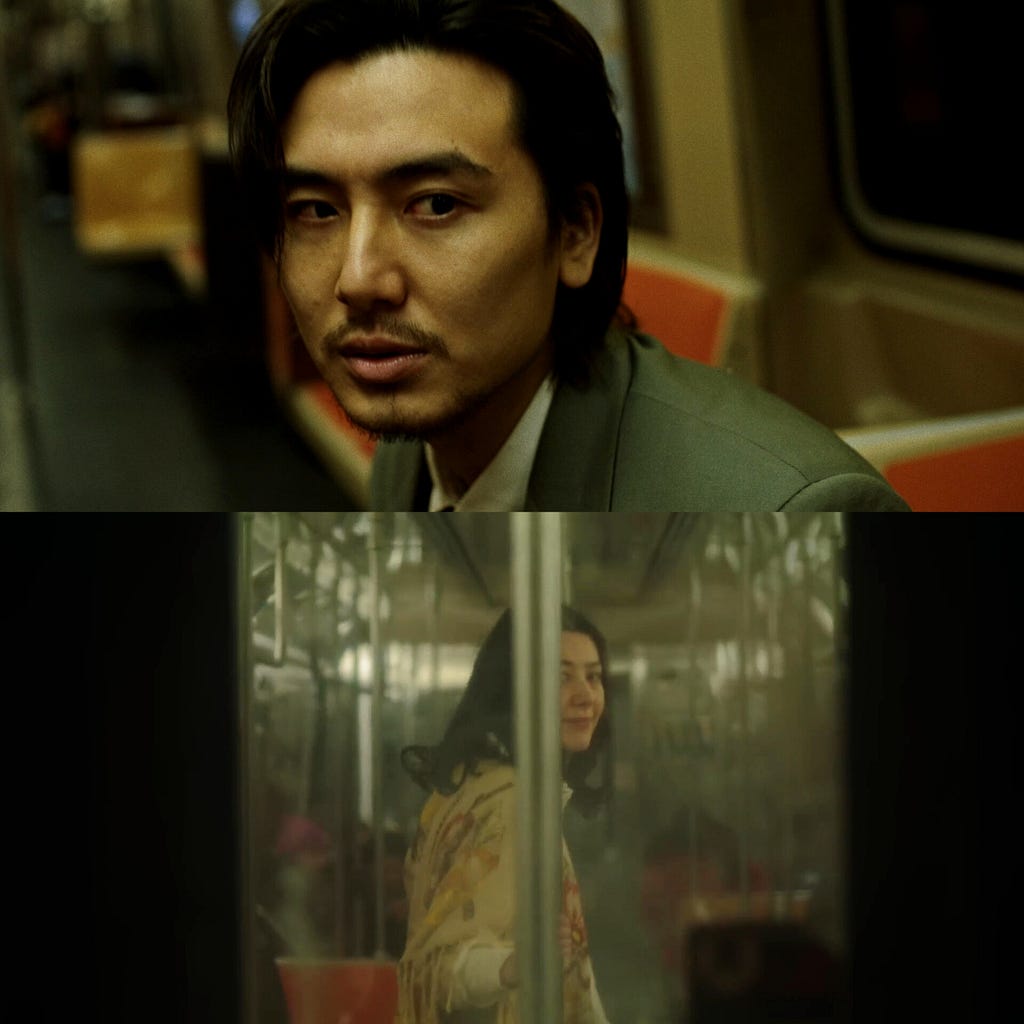 Two scenes From Fujii Kaze — Michi Teyu Ku (Overflowing) /Official Music Video. The first scene is Fujii Kaze, wearing a suit and black hair, playing the role of young Kaze who is sitting feeling vulnerable on the metro ride home and then sees the reflection of his deceased mother in the next carriage while smiling and looking back at him (next scene). The atmosphere feels warm but gloomy with nostalgic colors.