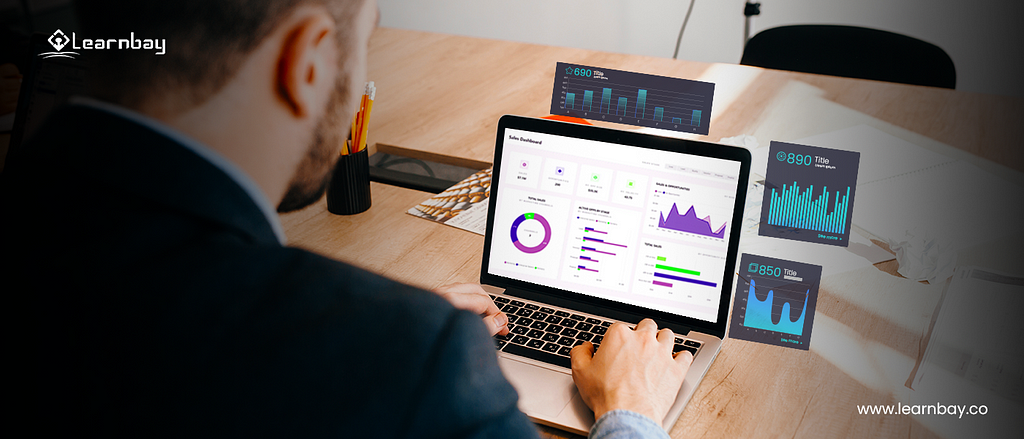 A picture shows a professional seated with a laptop that displays different analytical charts such as, ‘donut chart’, ‘area stacked chart’, and ‘horizontal bar graphs’ with details. It is surrounded by analytical insights with different graphs and numerical.