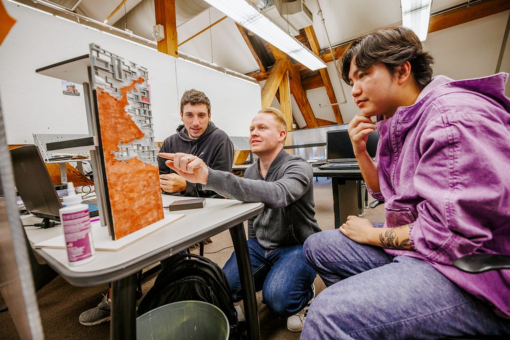 Assistant Professor Matthew Miller critiques student’s projects in the architecture design studio.