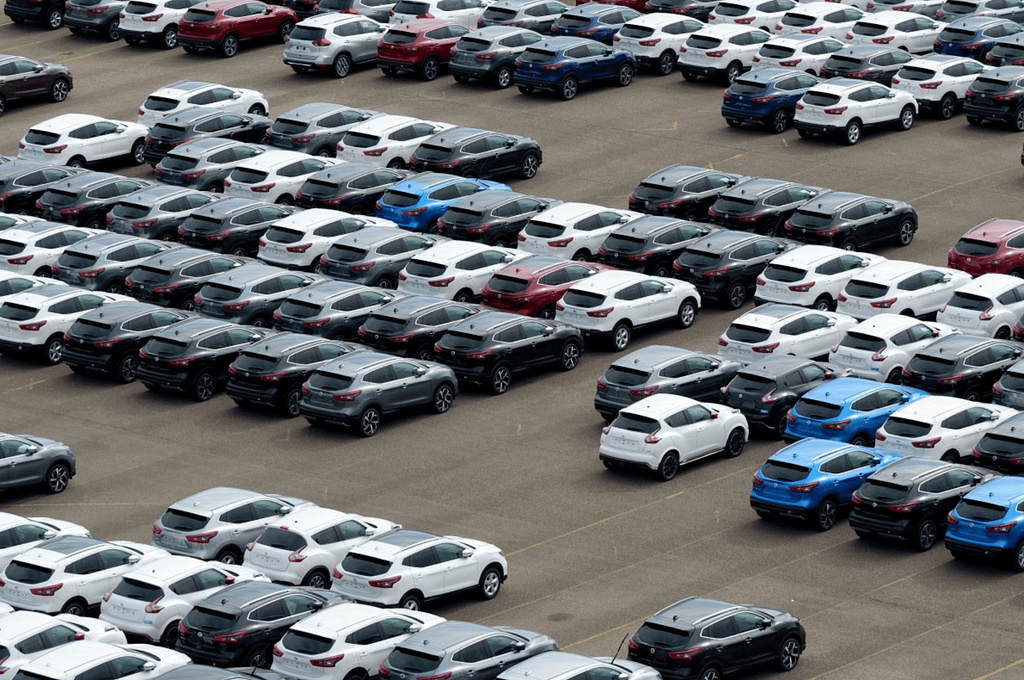 A dealership parking lot full of vehicles.