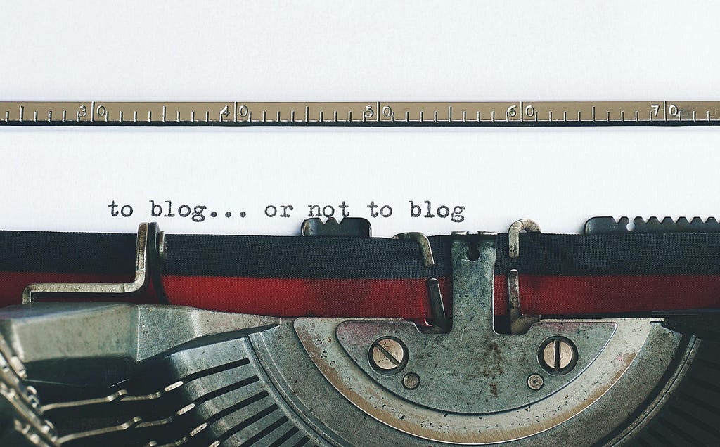 A Vintage Typewriter writing: to blog or not to blog.