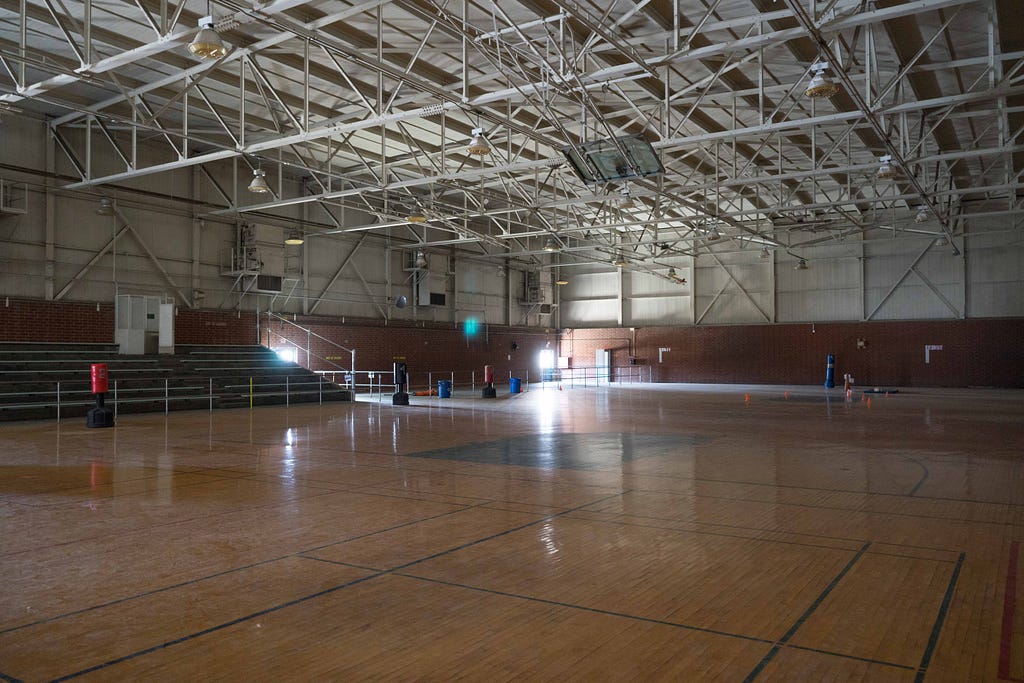 To accomodate more seating, the boxing ring was moved to the new YTS basketball gym for the big fight in 1987. (Photo by David William Reeve)