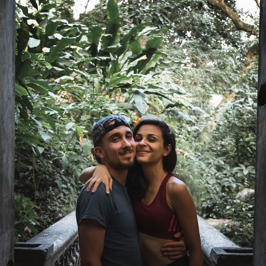 A cute couple pose for a photo in a Brazilian jungle. They look truly happy together!