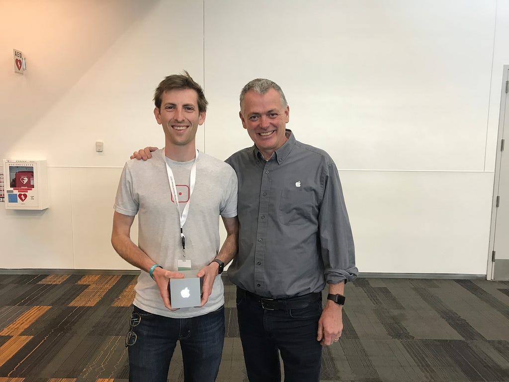 Ryan McLeod holding an Apple Design Award with John Geleynse
