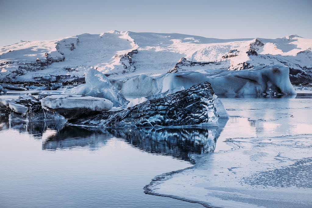 A snowy mountainous shoreline