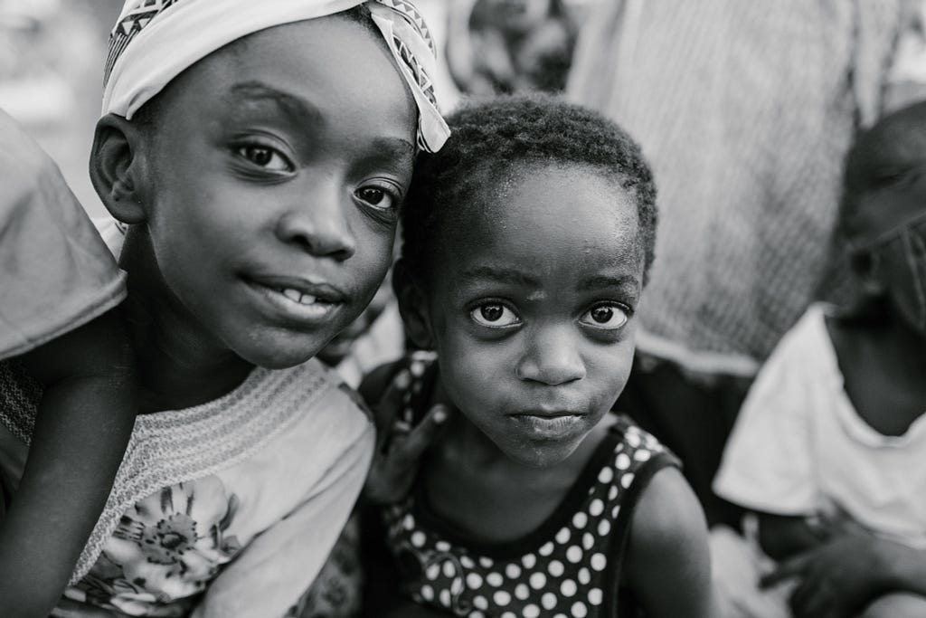 monochrome photo of two young black children