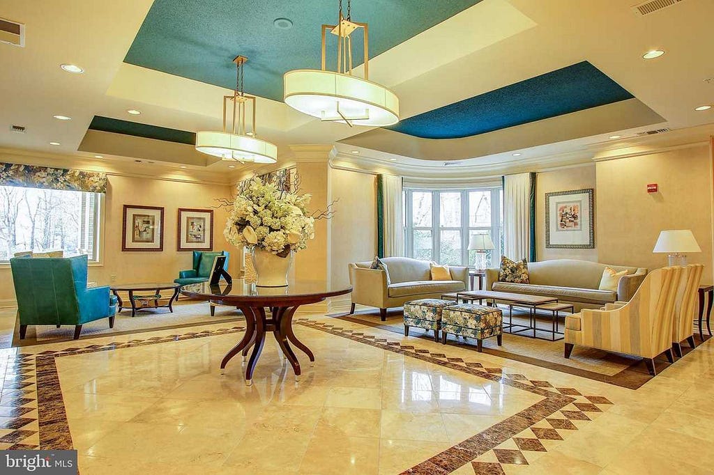 Entry way of the Stratford Condo Building in Reston, VA — Location of Condo For Sale