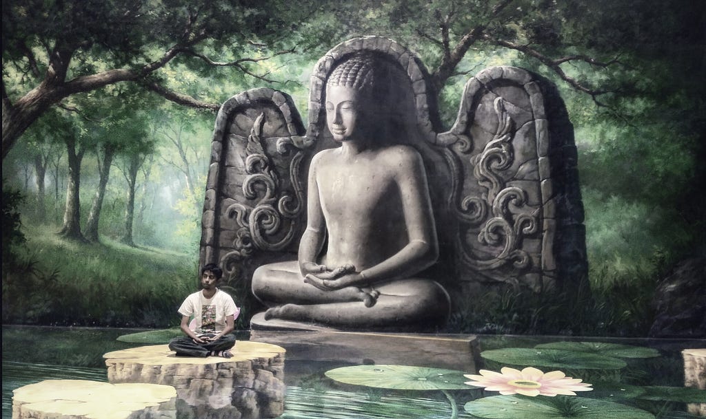 Hussain M Elius meditating in front of Buddha mural at Art in Paradise in Pattaya, Thailand