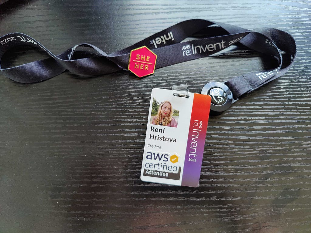 My AWS re:Invent attendee badge with “AWS Certified” sticker