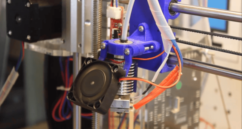 The intricate workings of a 3D printer’s extruder, where precision meets innovation in additive manufacturing.