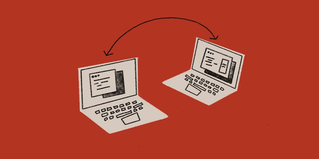Two laptops with code interfaces and a connecting line to show a connected experience