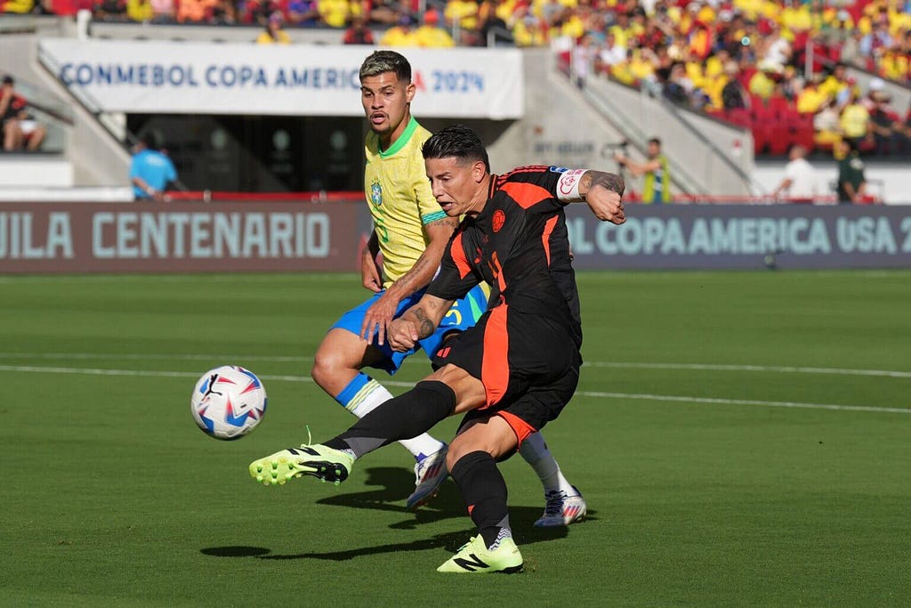 James Rodriguez takes a shot during the first half