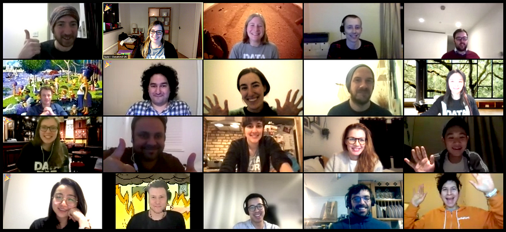 Screenshot of a Zoom call with a large group of adults waving and smiling