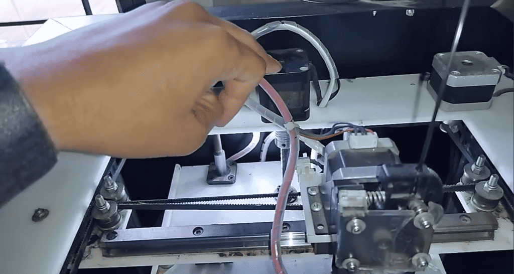 Precision in progress: Adjusting the Z-axis motor of a 3D printer for optimal performance.