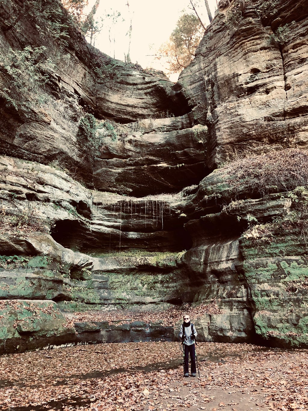 Photo of a young man standing in a canyon in Starved Rock State Park in Oglesby, Illinois.