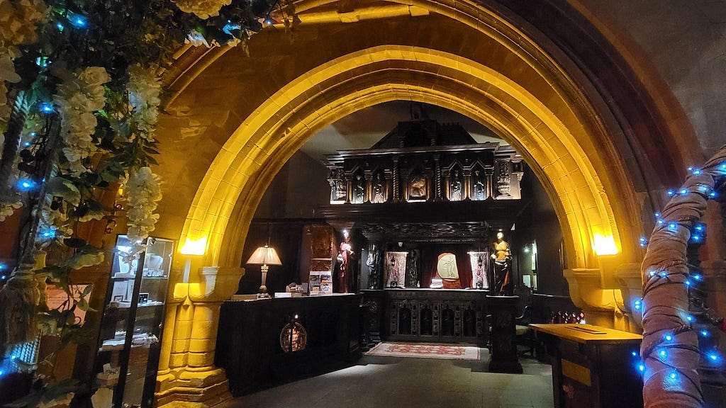 The front desk of Coombe Abbey, dramatically lit. Photo by Laura Metze.