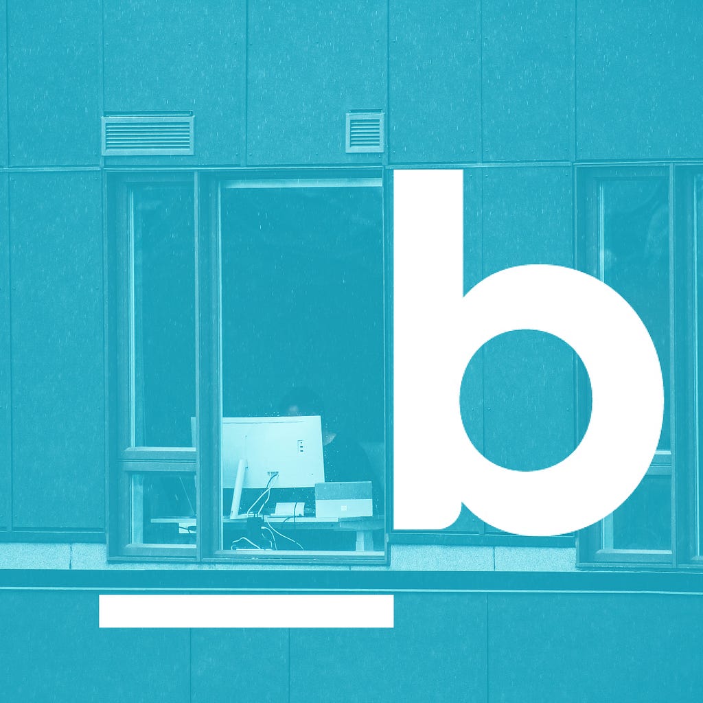 Slalom Build logo, behind it an image of a woman working at a desk in the window of a building.