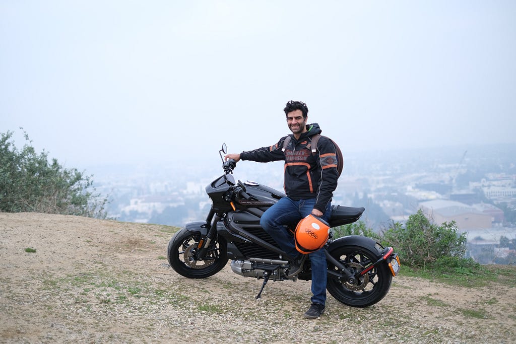 Dana posing with Harley Davidson LiveWire in San Francisco