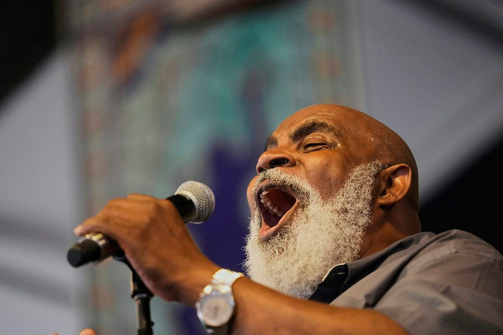 A man singing into a microphone