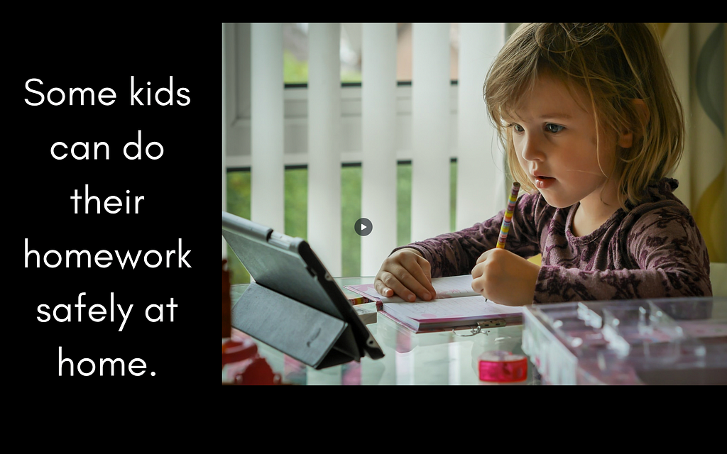 Some kids can do their homework safely at home. Picture of cute young girl with computing device working at a table.