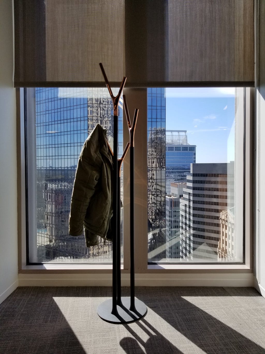 Just a coat rack with a coat on it. Not a guy or anything