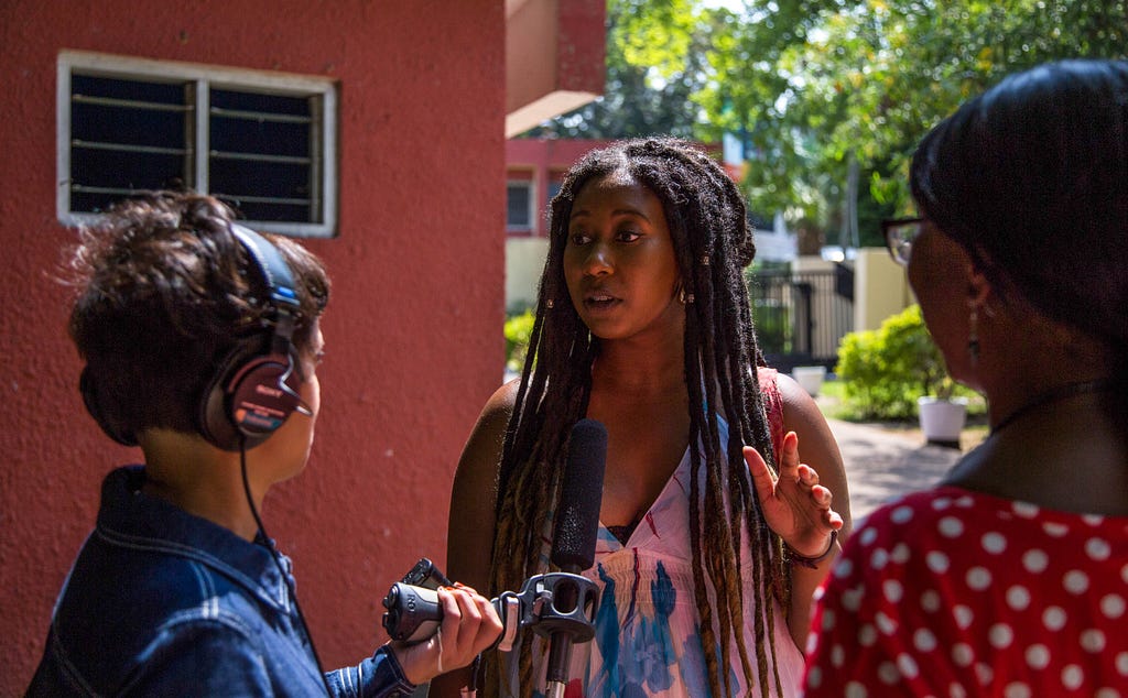 The World Reporter Rupa Shenoy interviews a source during a reporting trip to Ghana.