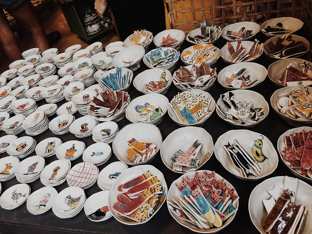 a display of artistic dinnerware and other knickknacks for business
