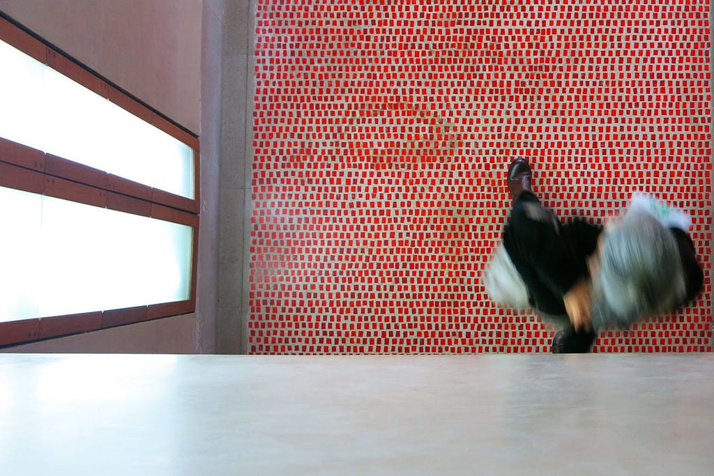Top view of walking woman over red tiled floor